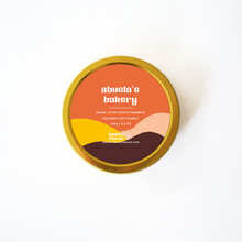 Load image into Gallery viewer, Candle tin with &#39;abuela&#39;s bakery&#39; branding on a white background
