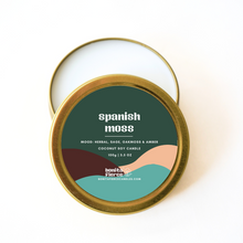 Load image into Gallery viewer, Candle tin labeled &#39;Spanish Moss&#39; with a green label on a white background

